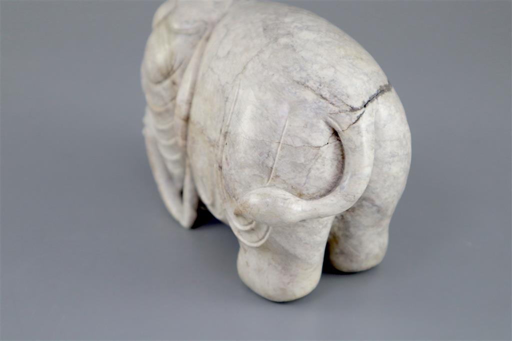 A Chinese burnt jade figure of an elephant, 15.5cm long